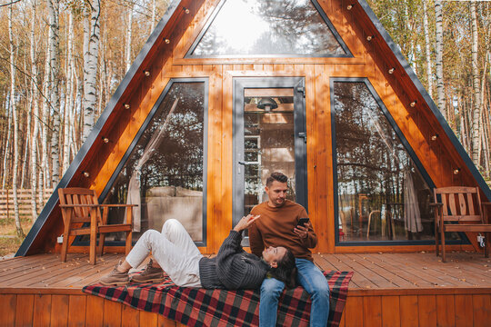 Happy family of two on the terrace in autumn