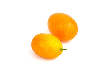 Two kumquats isolated on white background