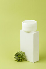 Blank white plastic container for cream, lotion, nourishing or moisturizing mask. Eco-friendly, organic cosmetology.