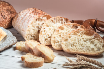 Various rustic bread on a wooden board. Healthy food and farming concept