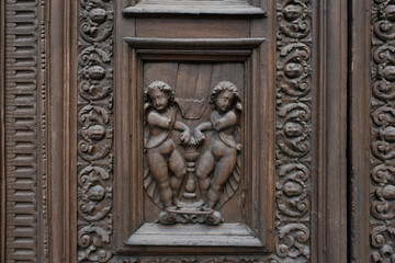 Fototapeta na wymiar old ornate wooden door with beautiful carvings