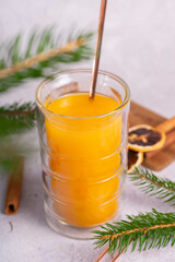 selective focus. honey cake with delicate cream. on a light background with craft paper. in the background is a jar of light honey