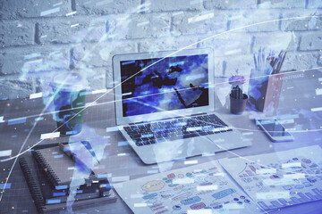 Double exposure of desktop computer and technology theme hologram. Concept of software development.