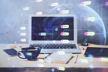 Double exposure of desktop computer and technology theme hologram. Concept of software development.