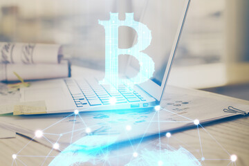 Double exposure of blockchain theme hologram and table with computer background. Concept of bitcoin...