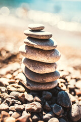 Fototapeta na wymiar A slide of stones balances under its own weight - harmony in nature - strength and confidence
