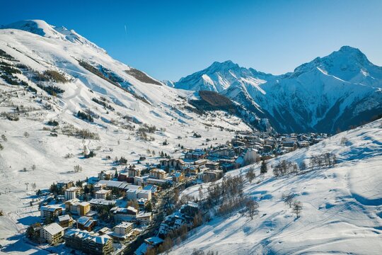 Les deux alpes resort in winter, French alps, Rhone Alpes in France aerial drone photo