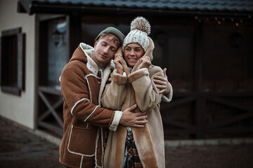 Obraz premium Beautiful young couple. Couple in love. Lifestyle. Man and woman. Holidays. Winter day. 