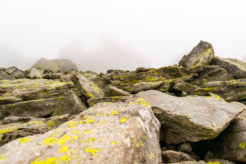 Landscape on Monte Avaro, Cusio, Bergamo, Italy. Rocky slope on a foggy autumn day