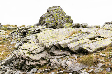 Landscape on Monte Avaro, Cusio, Bergamo, Italy. Rocky slope on a foggy autumn day