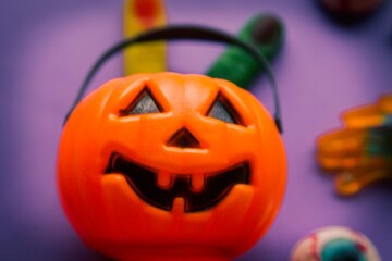 halloween candies seen close up on lilac background