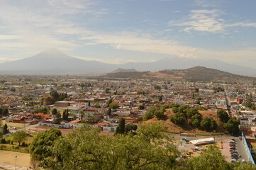 The city of Heroica Puebla de Zaragoza at the foot of the Popocatepetl volcano, Mexico