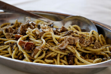 Close up view of a dish of spaghetti alla chitarra with fresh truffle and mushrooms a typical Italian plate from Abruzzo region