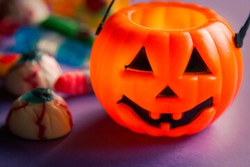 halloween candies seen close up on lilac background