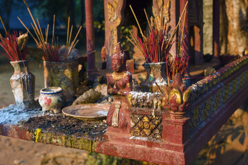 banyan tree and spirit house in the courtyard of the Bakong temple, Siem Reap in Cambodia
