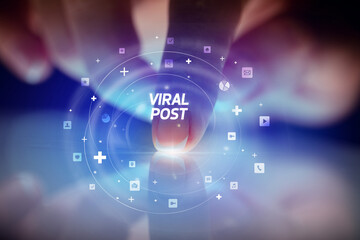 Finger touching tablet with social media icons and VIRAL POST