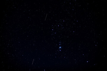 Obraz na płótnie Canvas The Orion constellation visible in a starry night sky