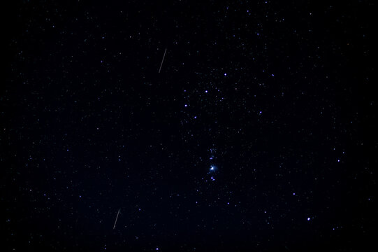 The Orion constellation visible in a starry night sky