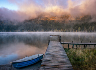 a beautiful morning at the edge of a lake
