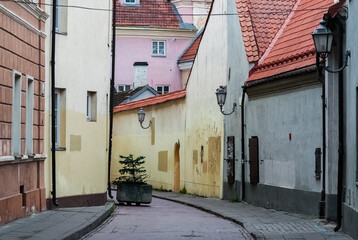 Narrow, colorful street in the old town of Vilnius, Lithuania.