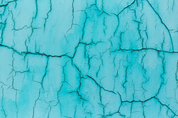 Natural abstract background of textured blue cracked wall.