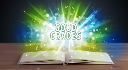 GOOD GRADES inscription coming out from an open book, educational concept