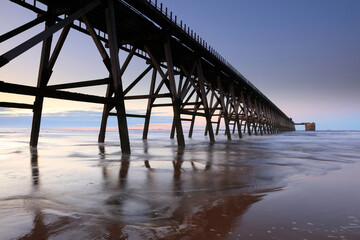 View of a Disused Pier on a calm day with clear blue sky. Hartlepool, County Durham, England, UK.