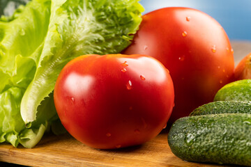 Fresh salad, tomatoes on cucumbers closeup