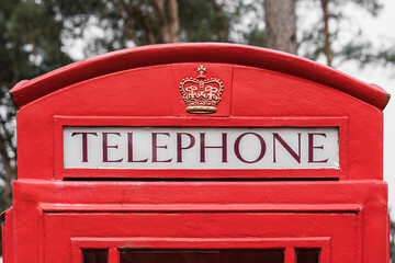 Top of a classic red telephone box.