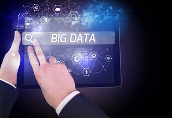 Close-up of a tablet searching BIG DATA inscription, hi-tech computing concept