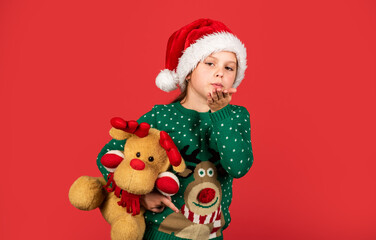 Christmas present. small santa kid red background. little girl present toy. winter holiday shopping. time for presents. gift brings joy and happiness. happy new year. merry christmas. xmas joy mood