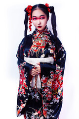 young pretty geisha in black kimono with sakura, asian ethno closeup on white background isolated