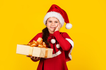 Great gift. big christmas sale. child santa hat hold gift box. boxing day concept. all i dream about. happy new year. winter holiday and xmas joy. seasonal shopping discount. small girl carry present