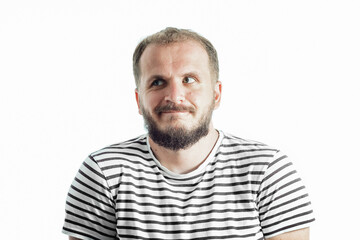 Obraz premium Perplexity bearded man in a striped T-shirt looking away. 30-35 years old. Isolated on white.