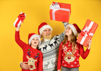 Presents for everybody. Family shopping. Christmas sale. Dad kids having fun. Father and little daughters celebrate new year together. Christmas becomes special with children. Christmas eve concept