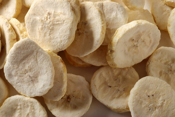 Pile of sweet dehydrated banana slices.
