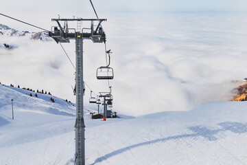 Winter mountains panorama with ski slopes and ski lifts in Tian Shan