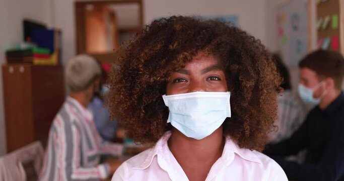 African business woman wearing face protective mask at startup meeting during coronavirus outbreak