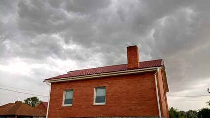 Thunderstorm clouds over the house