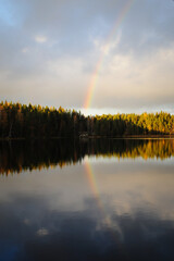 Rainbow over the lake Ruuhilampi in Noux, Espoo Finland