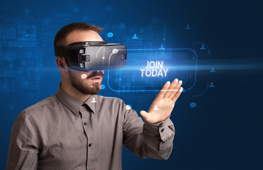 Businessman looking through Virtual Reality glasses with JOIN TODAY inscription, social networking concept