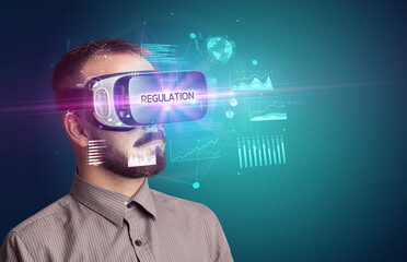 Businessman looking through Virtual Reality glasses with REGULATION inscription, new business concept