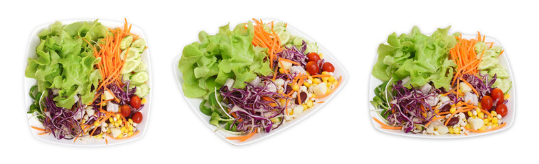 Vegetable salad in white plate on white background.