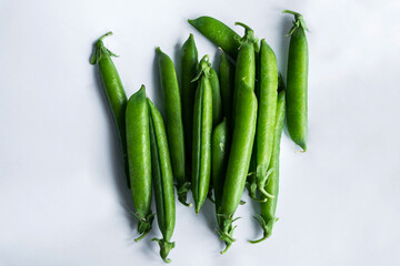 Pea pods on an isolated white background.