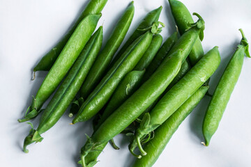 Pea pods on an isolated white background.
