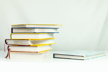 Books on the table white background, copy space