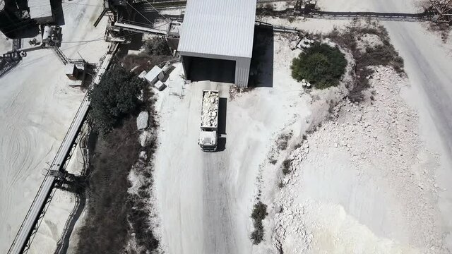 Aerial view on a truck loaded with lime at quarry factory.