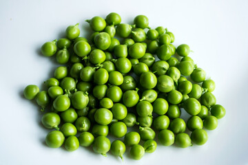Green peas on an isolated white background.
