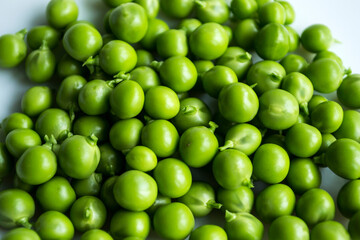Green peas on an isolated white background.