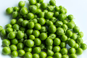 Green peas on an isolated white background.